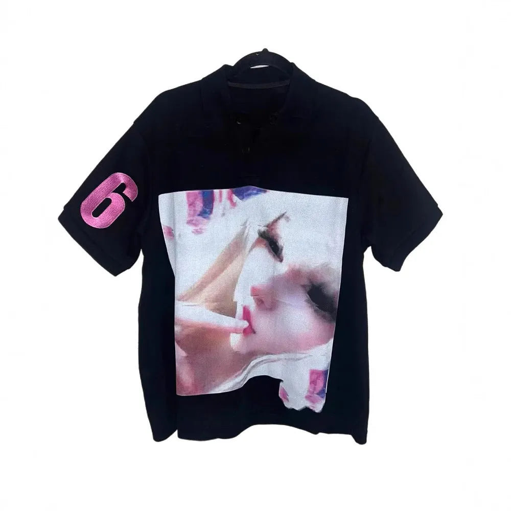 Short sleeved polyester polo shirt with a printed pattern, shown in a straight cut and medium length.