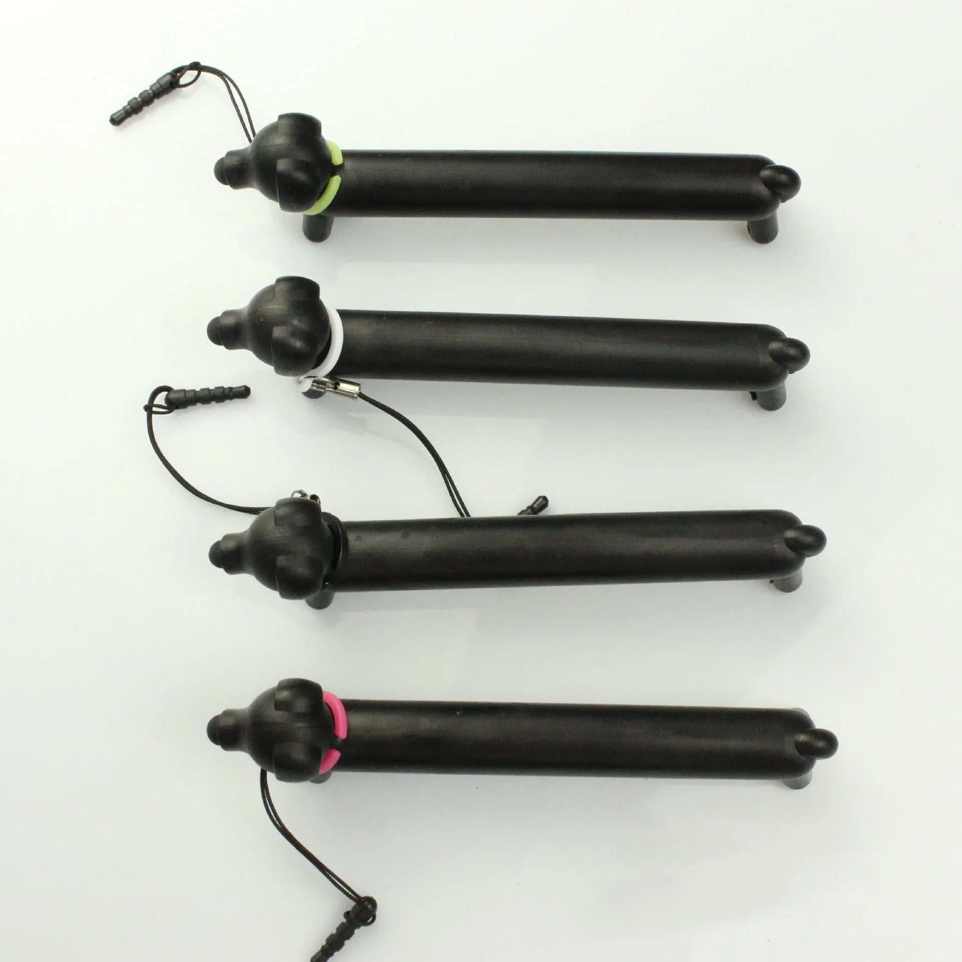Black dog-shaped touch screen stylus with conductive silicone body on white background