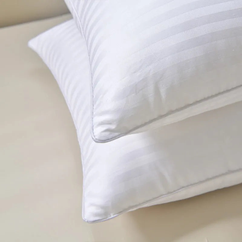 White satin stripe feather and cotton pillow shown in three different size options.