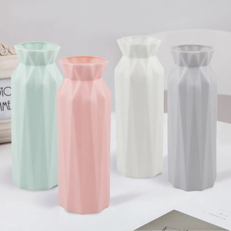 Green melamine plastic vase with a wide 7.2cm base on a wooden table.