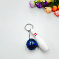 Mini bowling simulation keychain pendant in PVC metal showing four colour options