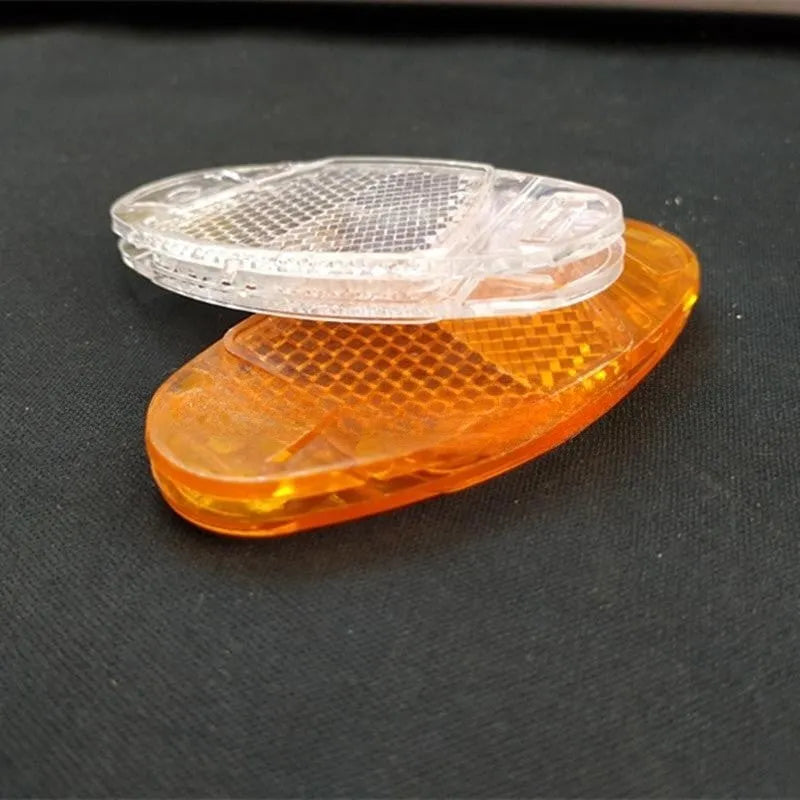 Bicycle plastic spoke reflector in white or yellow measuring 7.2cm length by 3.5cm width