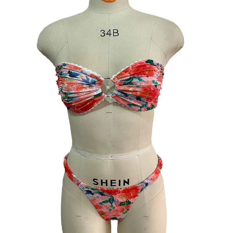 Women's floral print bikini set with lace trim on tube top and briefs in blue colour