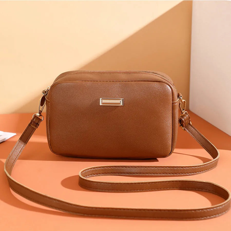 Women's solid colour PU shoulder bag with three-dimensional pocket in horizontal square shape