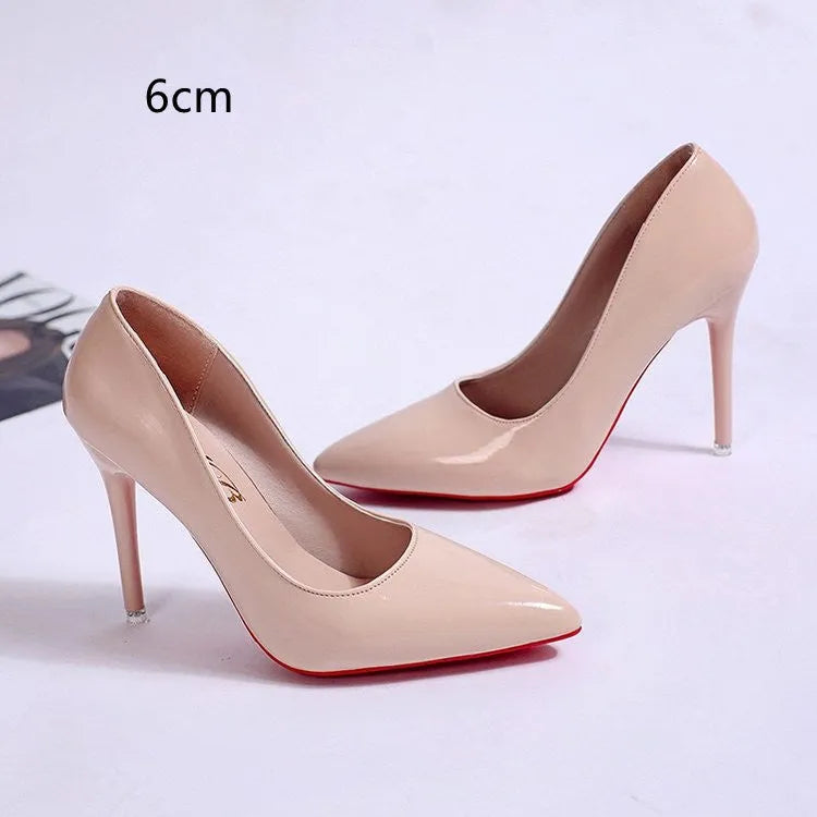 Women's black stiletto heel pump with pointed toe and shallow mouth design on a white background.